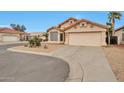 Inviting single-level home features a two-car garage and low maintenance landscaping at 11540 W Sonoran Ct, Surprise, AZ 85378