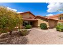 Inviting single-story home showcasing desert landscaping, large windows, and a terracotta tile roof at 12436 S 38Th Pl, Phoenix, AZ 85044