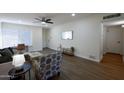 Cozy living room with wood floors featuring comfortable seating and access to the entry at 1302 E Maryland Ave # 15, Phoenix, AZ 85014