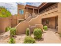 Beautiful southwestern style home featuring multiple balconies, a landscaped yard, and private entrance at 13300 E Via Linda -- # 1065, Scottsdale, AZ 85259