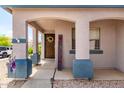 Inviting front porch with decorative welcome sign and desert landscaping, creating a warm and welcoming entryway at 1475 E Avenida Kino --, Casa Grande, AZ 85122