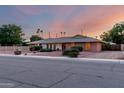 Well-maintained single-story home with a tidy yard, complemented by mature trees and a quaint design at 2148 E Cairo Dr, Tempe, AZ 85282