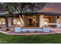 Inviting front porch with stylish lanterns, decorative brickwork, colorful plants and a cozy bench at 226 W Ranch Rd, Tempe, AZ 85284