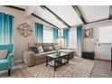 Comfortable living room with stylish decor, wood-look floors, and ample natural light at 3104 E Broadway Rd # 170, Mesa, AZ 85204