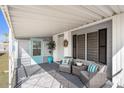 Cozy covered porch featuring comfortable seating and a welcoming decor at 3104 E Broadway Rd # 170, Mesa, AZ 85204