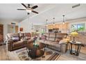 Inviting living room featuring hardwood floors, a ceiling fan, and views into the kitchen at 39606 N 3Rd Ave, Phoenix, AZ 85086
