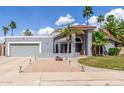 Inviting single-story home with a tile roof, desert landscaping, and a two-car garage at 412 W Curry St, Chandler, AZ 85225