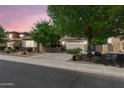 Charming home with a well-manicured front yard and desert landscaping, with a driveway leading to a two-car garage at 4340 S Marble St, Gilbert, AZ 85297