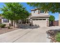 Inviting two-story home with a well-kept lawn and an attached two-car garage at 4340 S Marble St, Gilbert, AZ 85297