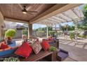 Comfortable outdoor seating on a covered patio, perfect for relaxing and entertaining at 4340 S Marble St, Gilbert, AZ 85297