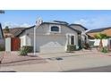 Charming single-Gathering home featuring a two-car garage, desert landscaping and lovely curb appeal at 4362 W Behrend Dr, Glendale, AZ 85308