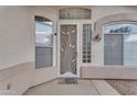 Elegant front entrance with decorative door, windows, and arched details, offering a welcoming first impression at 4809 W Erie St, Chandler, AZ 85226