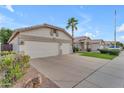 Charming single-story home featuring a wide driveway, spacious two-car garage, and well-maintained landscaping at 4809 W Erie St, Chandler, AZ 85226