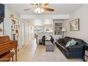 Bright living room with tile floors, a ceiling fan, and comfortable seating at 5808 E Brown Rd # 140, Mesa, AZ 85205