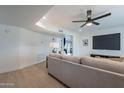 Bright living room with wood floors, neutral decor, and a ceiling fan at 711 N 22Nd St, Mesa, AZ 85213