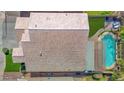 Aerial view of a home with a private backyard pool and lush green lawn at 740 N Bradley Dr, Chandler, AZ 85226