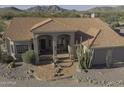 Desert home with red tile roof and desert landscaping at 9690 W Martin Rd, Casa Grande, AZ 85194