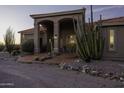 Desert home with desert landscaping at twilight at 9690 W Martin Rd, Casa Grande, AZ 85194