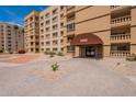 Condo building entrance with pavers and awning at 7960 E Camelback Rd # 110, Scottsdale, AZ 85251