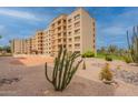 Exterior of condo building with cactus garden and desert landscaping at 7960 E Camelback Rd # 110, Scottsdale, AZ 85251