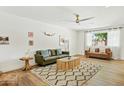 Inviting living room featuring modern decor, wood floors, and a cozy seating arrangement at 10832 N 37Th St, Phoenix, AZ 85028