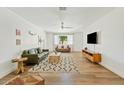 Bright living room with a ceiling fan, wood floors, and stylish furnishings at 10832 N 37Th St, Phoenix, AZ 85028