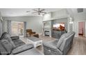 Comfortable living room featuring neutral colors, recessed lighting, and sliding door access at 1123 N Agave St, Casa Grande, AZ 85122