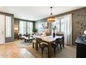 Open-concept living and dining area showcasing a modern dining table, stylish décor, and ample seating at 11988 W Nadine Way, Peoria, AZ 85383