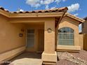 Inviting front porch with desert landscaping and charming welcome decor at 1314 W Kingbird Dr, Chandler, AZ 85286
