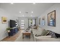 Cozy living room with a large sectional sofa, television, and stylish decor at 13419 N 35Th St, Phoenix, AZ 85032