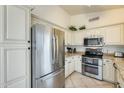 Well-appointed kitchen featuring stainless steel appliances, granite countertops, and ample cabinetry at 14300 W Bell Rd # 245, Surprise, AZ 85374
