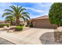 Beautiful single-story home featuring a tile roof, low-maintenance desert landscaping, and a two-car garage at 16331 W Tierra Way, Surprise, AZ 85374