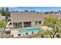 A refreshing pool with a spacious patio is the perfect place to relax and entertain in this private backyard oasis at 1694 E Mia Ln, Gilbert, AZ 85298