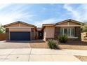 Charming single-Gathering home featuring stone accents, neutral tones, and a two-car garage at 22434 S 226Th Pl, Queen Creek, AZ 85142