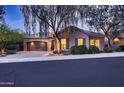 Inviting single-level home with desert landscaping, and a two-car garage under a tile roof at 25929 N 84Th Ln, Peoria, AZ 85383