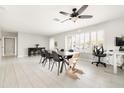 Spacious dining area with tiled floors and a contemporary ceiling fan for added comfort at 2710 E Cinnabar Ave, Phoenix, AZ 85028
