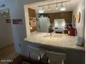 Modern kitchen with sleek countertops and stainless steel appliances at 3033 E Devonshire Ave # 3003, Phoenix, AZ 85016