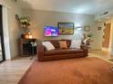 Inviting living room featuring a comfortable leather sofa and stylish decor at 3033 E Devonshire Ave # 3003, Phoenix, AZ 85016