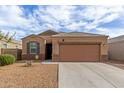 Charming single-story home with a neutral color palette, desert landscaping, and a two-car garage at 30993 W Indianola Ave, Buckeye, AZ 85396