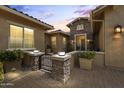 Inviting front entrance featuring stone accents, pavers, and a charming gated courtyard at 3381 E Azalea Dr, Chandler, AZ 85286