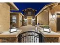 Charming front entrance features stone accents, a welcoming courtyard, and a decorative gate at 3381 E Azalea Dr, Chandler, AZ 85286