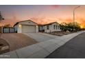 Single story home with driveway and tile roof, seen at sunset at 3673 E Horseshoe Dr, Chandler, AZ 85249