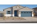 Charming single-story home featuring a blue garage door, shuttered window and neutral stucco at 37458 W San Clemente St, Maricopa, AZ 85138