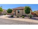 Attractive single-story house with desert landscaping, a tile roof, and an attached two-car garage at 40707 W Pryor Ln, Maricopa, AZ 85138