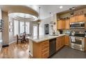 Bright kitchen with stainless steel appliances, an island, and breakfast nook at 4539 W Beautiful Ln, Laveen, AZ 85339