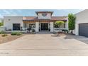 Charming single-story home with a welcoming entrance and well-manicured landscaping at 4617 E Elmwood Cir, Mesa, AZ 85205
