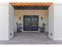 Covered entryway with double doors, sconces, and decorative wreaths offers curb appeal at 4617 E Elmwood Cir, Mesa, AZ 85205