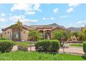 Stunning home featuring lush landscaping, a tile roof, and a mountain view at 5523 W Creekside Ln, San Tan Valley, AZ 85144