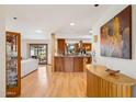 Open-concept living area with hardwood floors and abundant natural light at 6122 E Harvard St, Scottsdale, AZ 85257