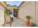 Private patio with travertine tile flooring and peaceful seating area at 6122 E Harvard St, Scottsdale, AZ 85257